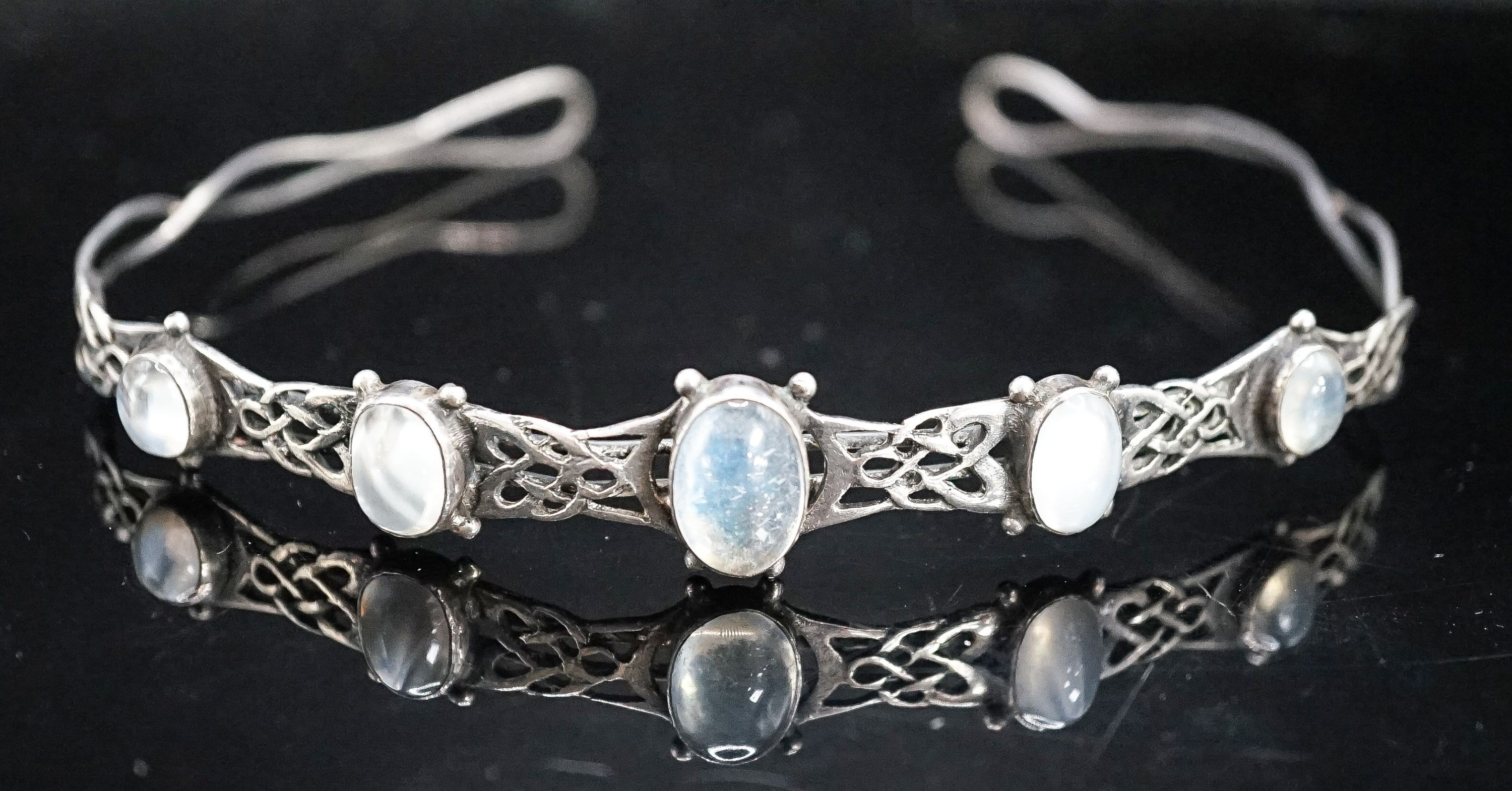 A white metal and graduated five stone cabochon moonstone set tiara, diameter 12.5cm